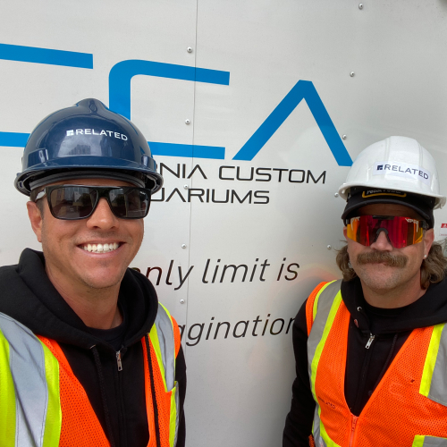 Two CCA technicians at an aquarium installation site